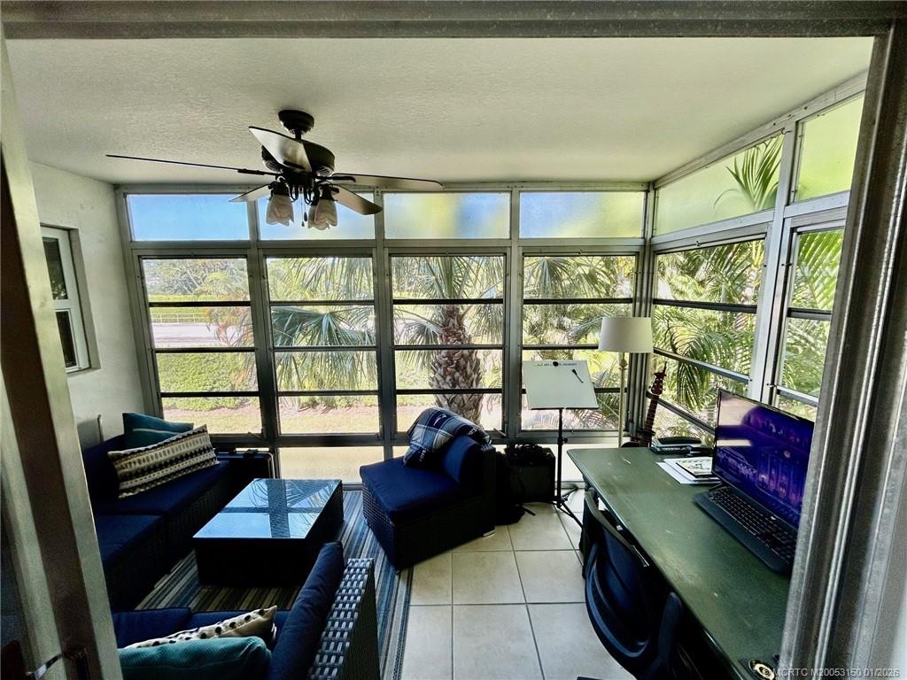 2950 Southeast Ocean Boulevard, Unit 546 Stuart, FL 34996 - Photo 21 of 33 a living room with furniture and a window