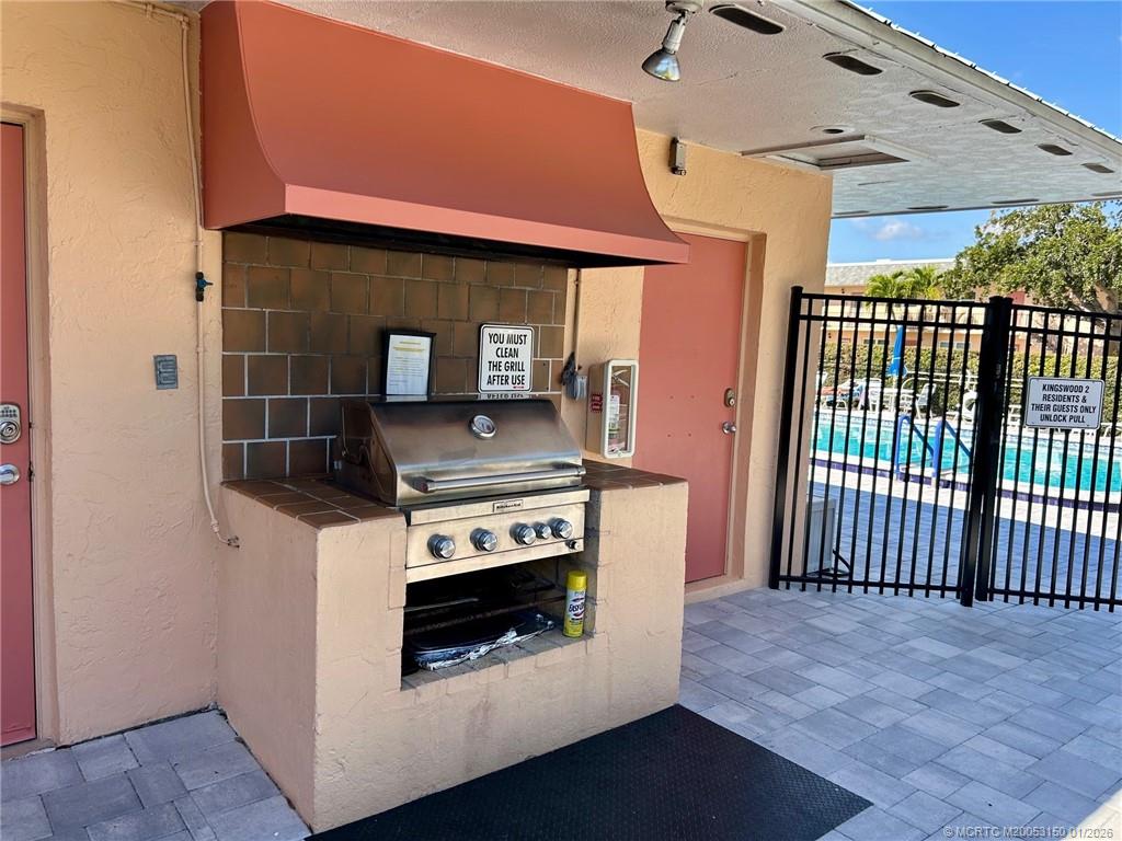 2950 Southeast Ocean Boulevard, Unit 546 Stuart, FL 34996 - Photo 32 of 33 a kitchen with a stove and a microwave