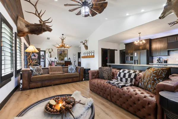 a kitchen with cabinets a sink and stainless steel appliances