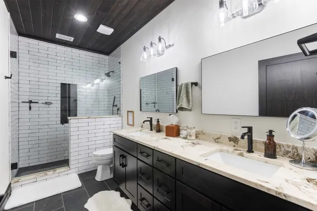 a green field with lots of trees