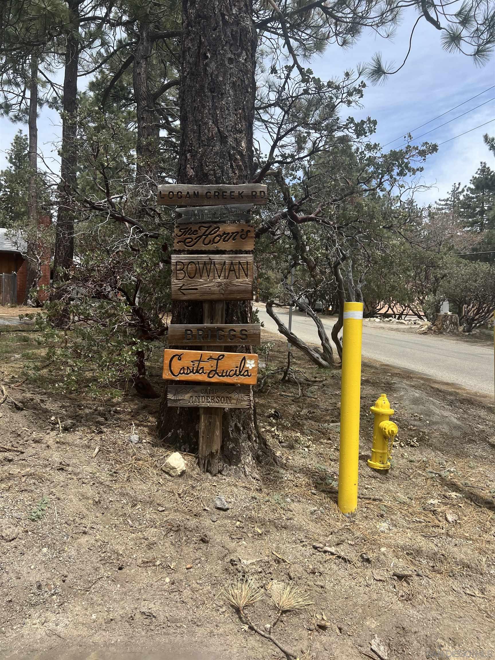 0 Logan Creek Road Idyllwild, CA 92549 - Photo 4 of 38 a backyard of a house with table and chairs