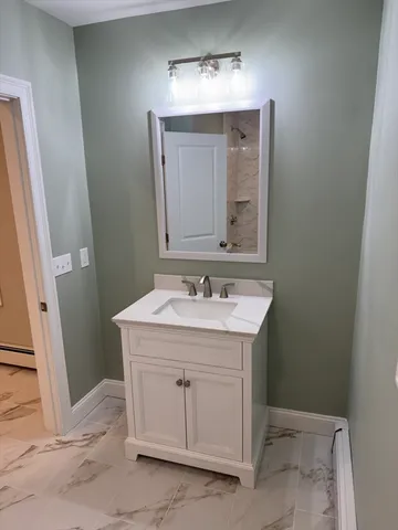 a bathroom with a sink and a mirror