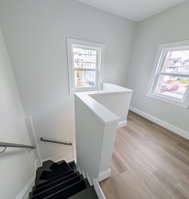121 Whitman Street, Unit 2 New Bedford, MA 02745 - Photo 10 of 11 a room with window and white walls