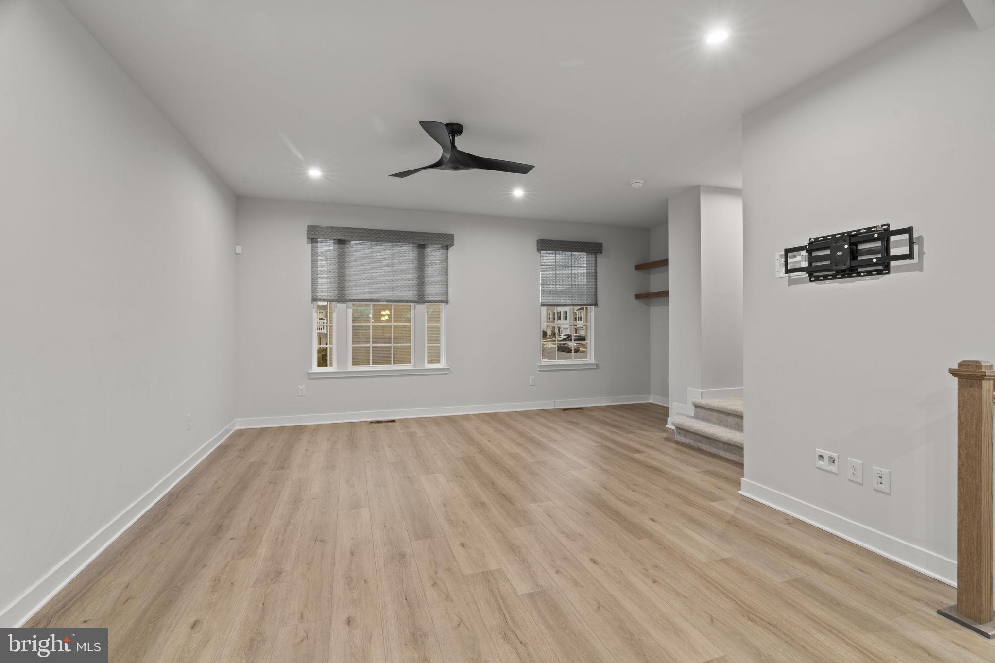 208 Freedom Way Sicklerville, NJ 08081 - Photo 13 of 34 wooden floor in an empty room with a window