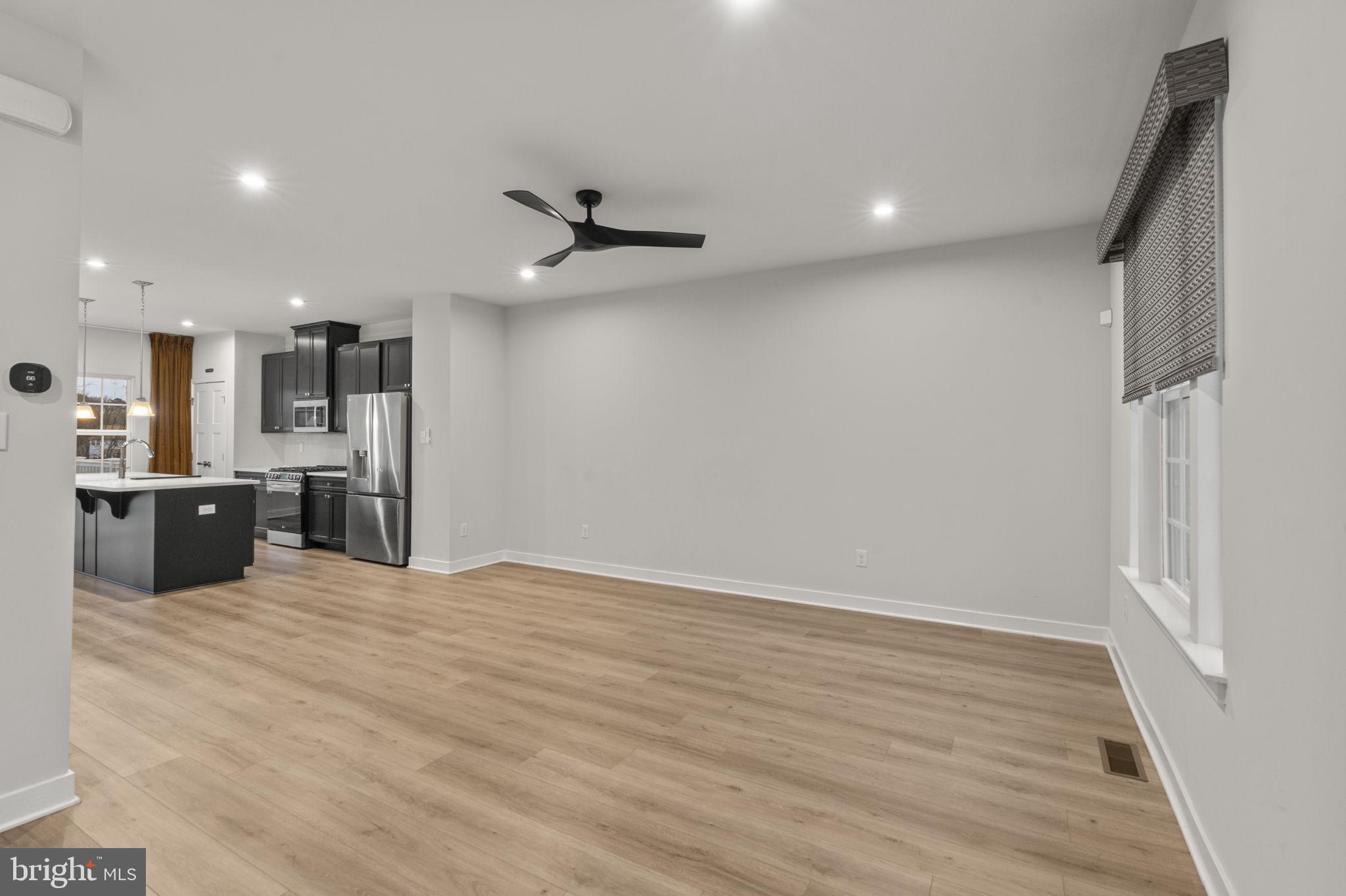 208 Freedom Way Sicklerville, NJ 08081 - Photo 15 of 34 a view of a kitchen with a sink and a refrigerator
