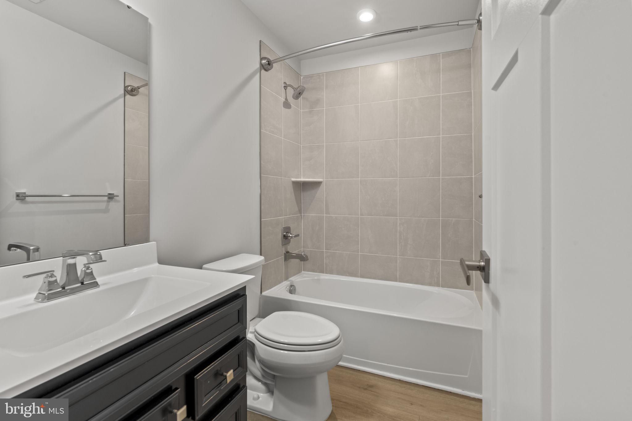 208 Freedom Way Sicklerville, NJ 08081 - Photo 22 of 34 a bathroom with a sink a toilet and shower