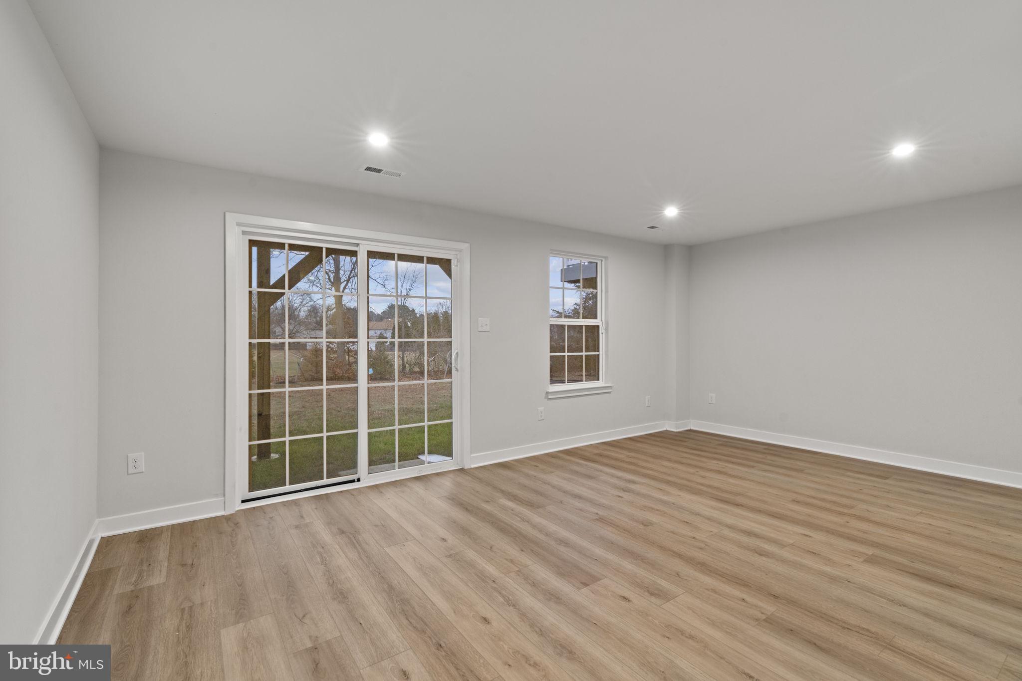 208 Freedom Way Sicklerville, NJ 08081 - Photo 3 of 34 a view of empty room with wooden floor and fan