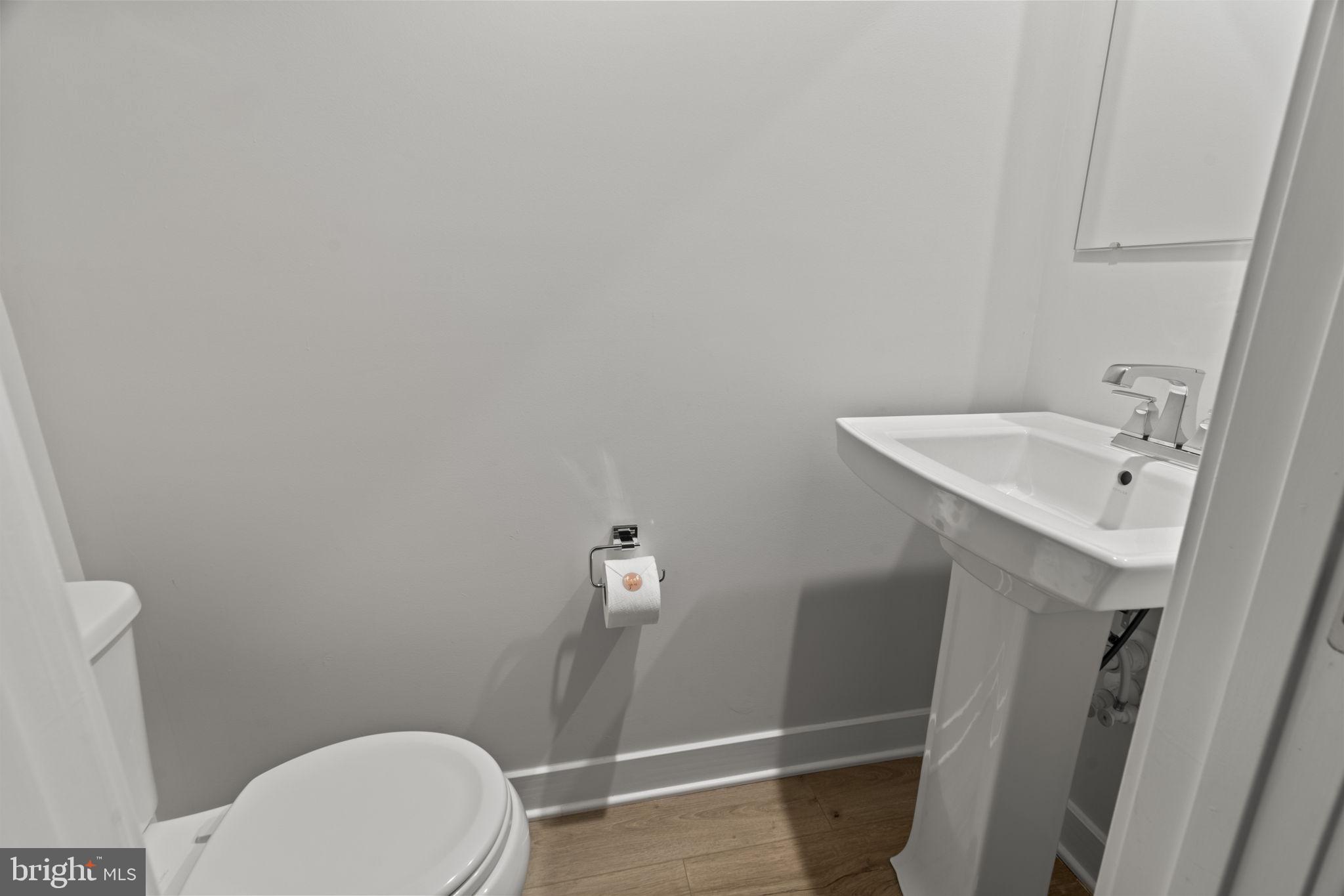 208 Freedom Way Sicklerville, NJ 08081 - Photo 6 of 34 a bathroom with a sink and a toilet