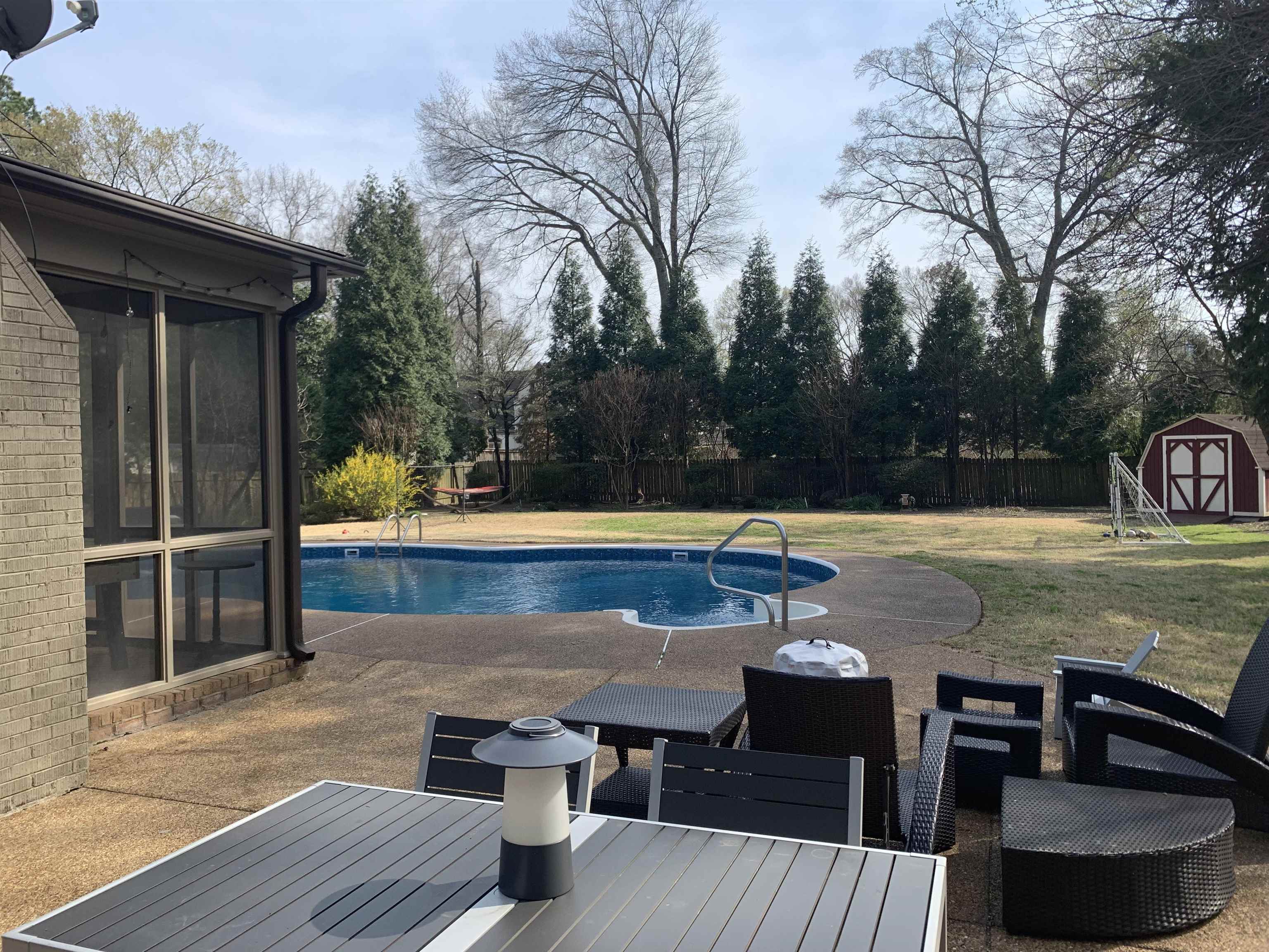 5179 Shady Grove Road Memphis, TN 38117 - Photo 3 of 25 a view of a swimming pool with seating space