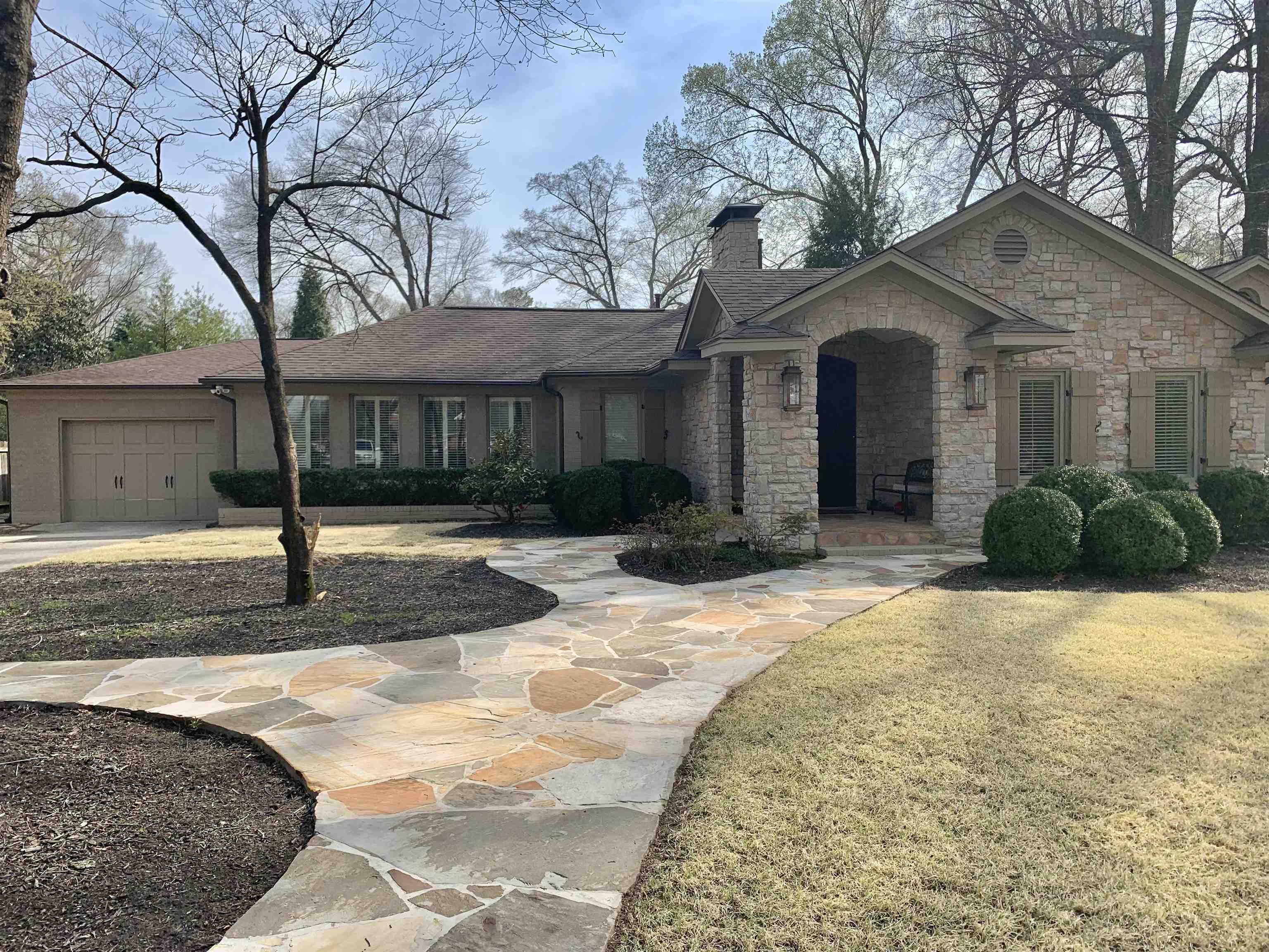 5179 Shady Grove Road Memphis, TN 38117 - Photo 4 of 25 a front view of a house with garden