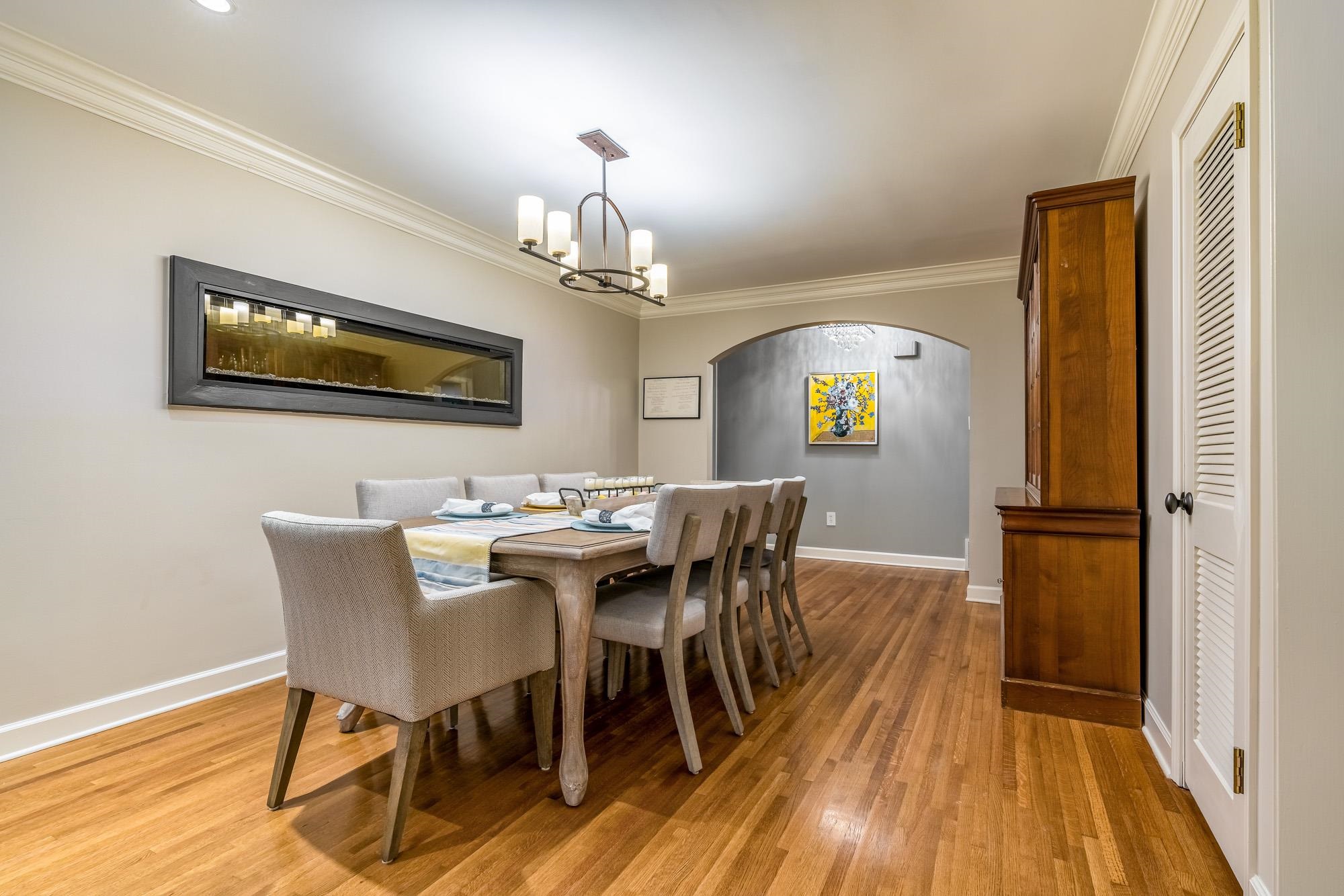 5179 Shady Grove Road Memphis, TN 38117 - Photo 7 of 25 a view of a dining room with furniture and wooden floor