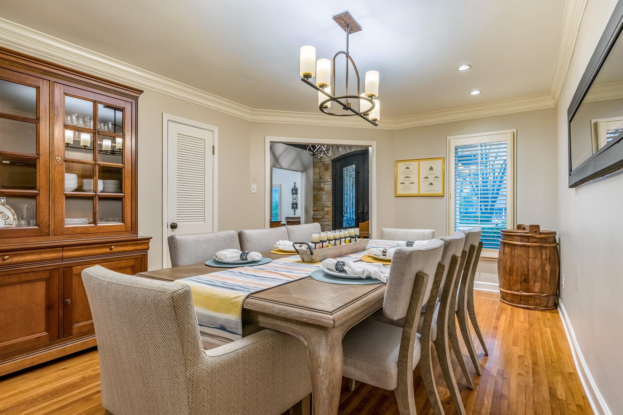 5179 Shady Grove Road Memphis, TN 38117 - Photo 8 of 25 a view of a dining room with furniture wooden floor and chandelier