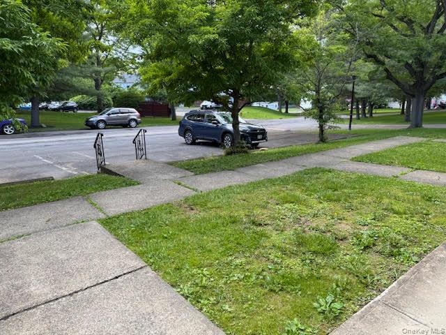 23 Brewster Road Cornwall, NY 12518 - Photo 2 of 39 View of grassy front yard with designated 2 parking spots in front of the entrance of the townhouse.