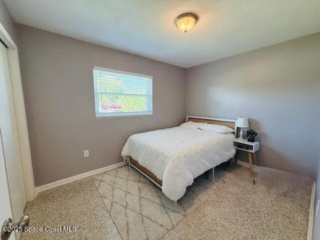 a bathroom with a sink toilet and mirror