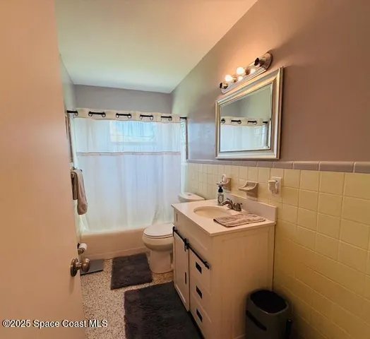 a view of storage and utility room with washer and dryer