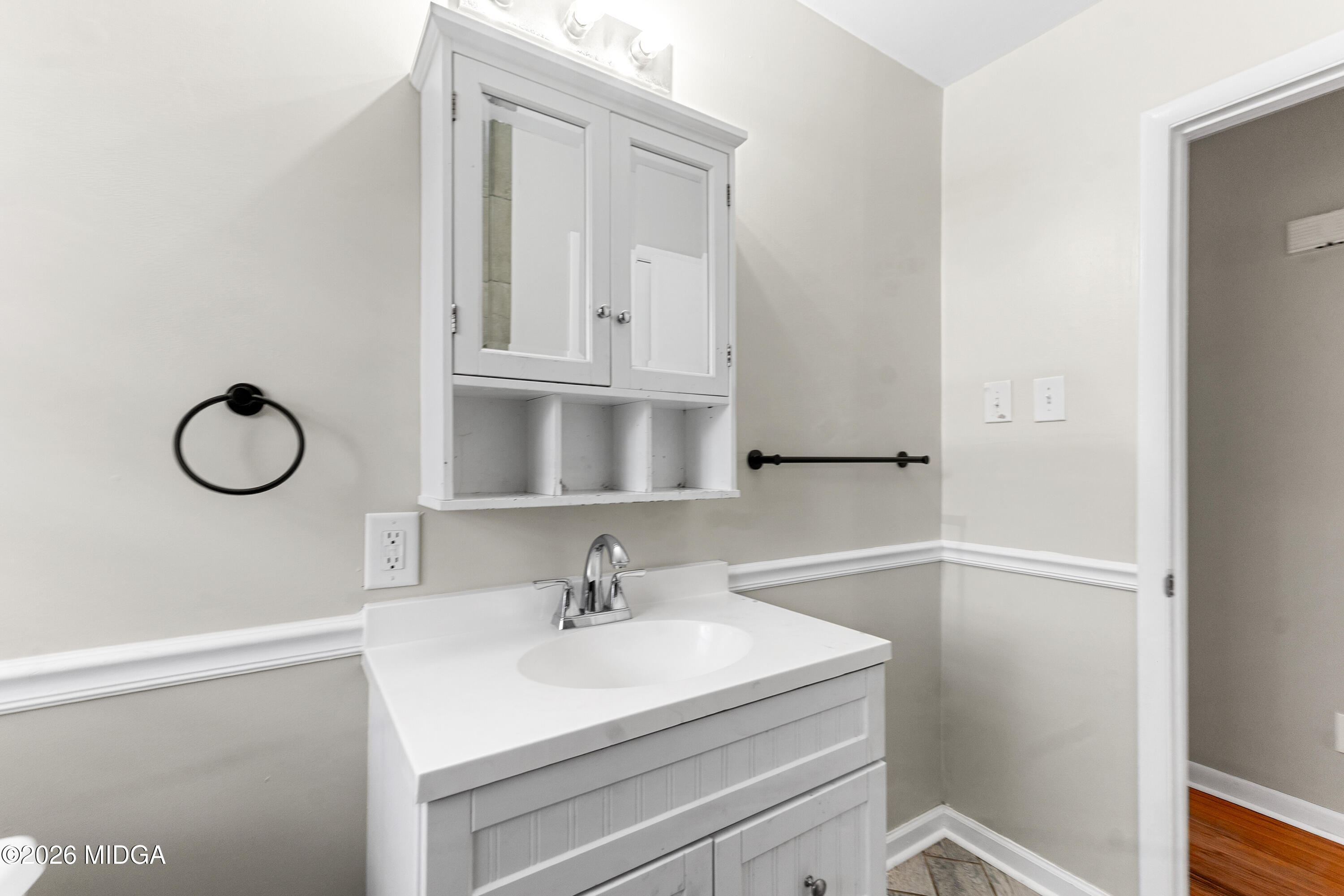 112 Athens Street Warner Robins, GA 31088 - Photo 14 of 42 a bathroom with a sink and a mirror