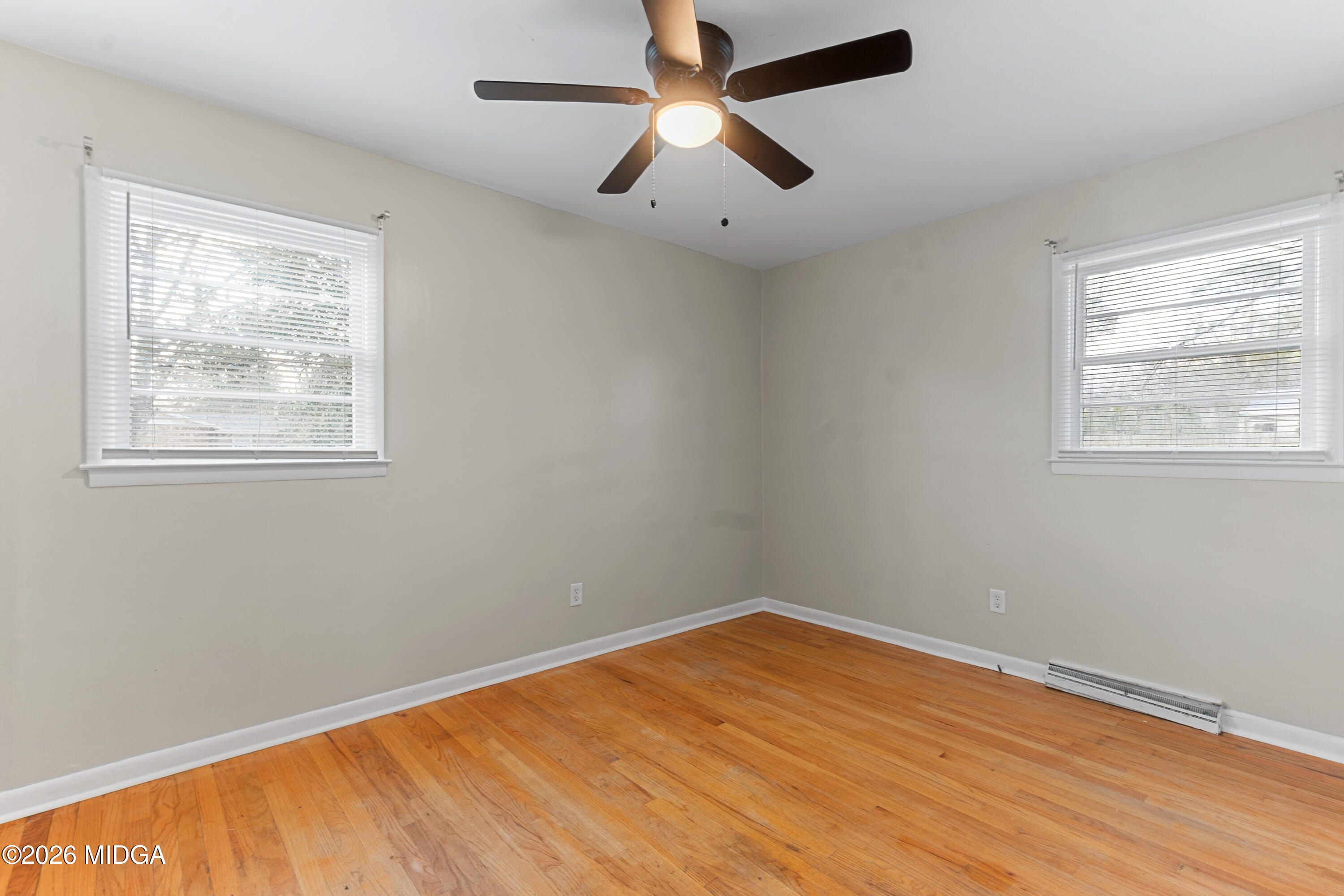 112 Athens Street Warner Robins, GA 31088 - Photo 18 of 42 a view of empty room with wooden floor and fan