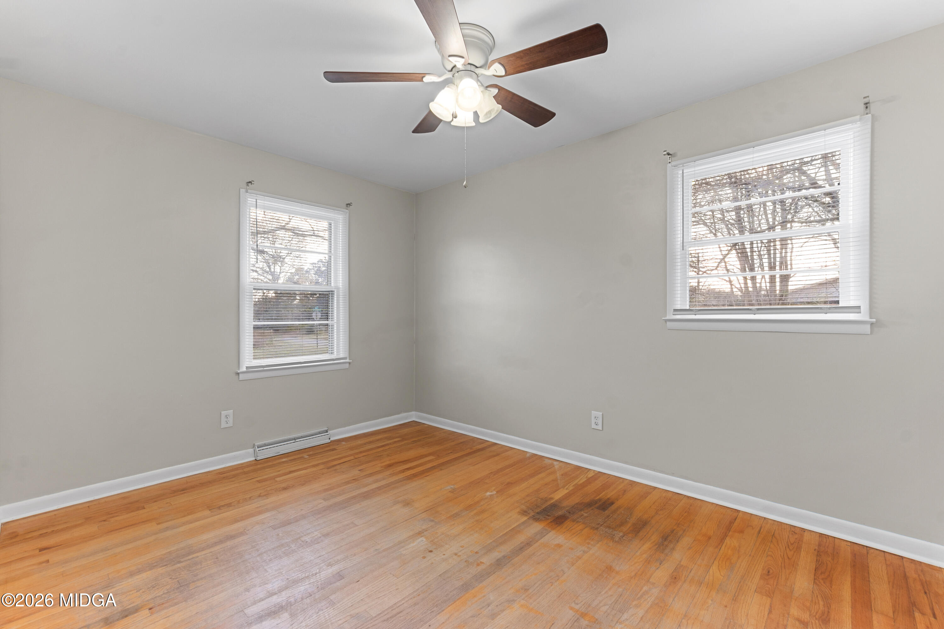 112 Athens Street Warner Robins, GA 31088 - Photo 21 of 42 a view of empty room with wooden floor and fan