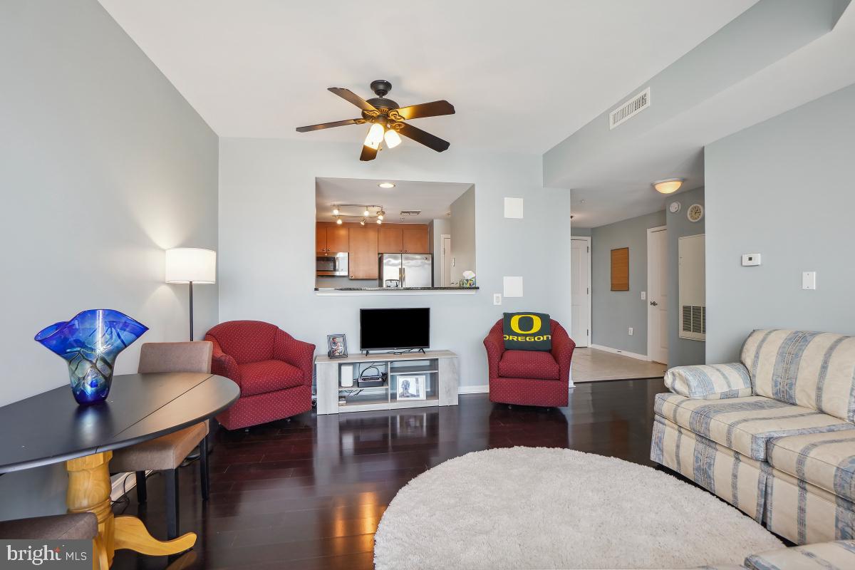 930 Wayne Avenue, Unit 1407 Silver Spring, MD 20910 - Photo 15 of 31 a living room with furniture and a fireplace