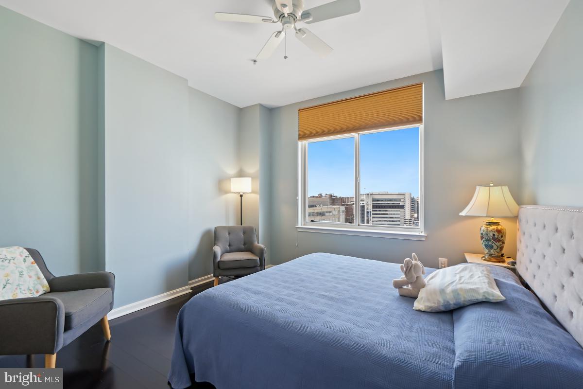 930 Wayne Avenue, Unit 1407 Silver Spring, MD 20910 - Photo 20 of 31 a bedroom with a bed and window