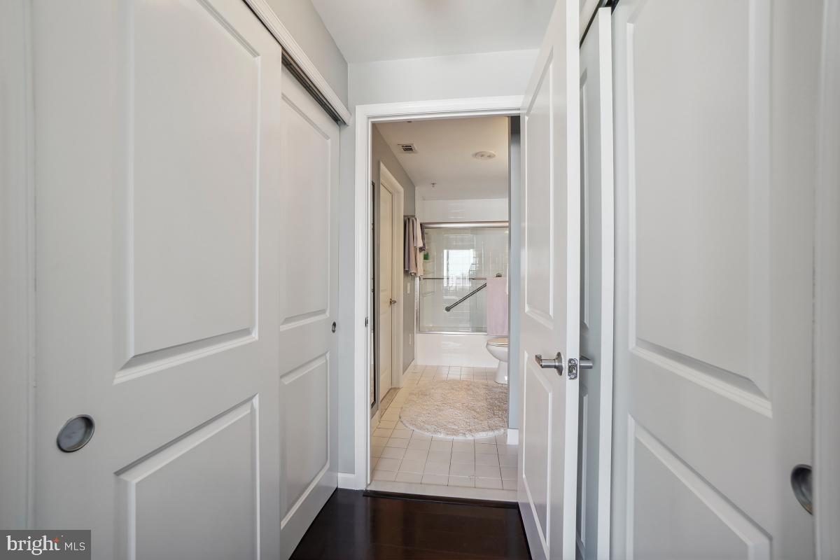 930 Wayne Avenue, Unit 1407 Silver Spring, MD 20910 - Photo 24 of 31 a view of a bathroom from a hallway
