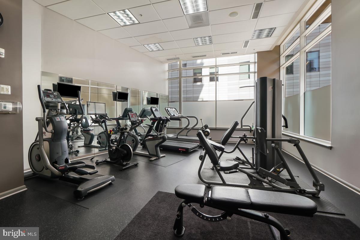 930 Wayne Avenue, Unit 1407 Silver Spring, MD 20910 - Photo 28 of 31 a view of a room with gym equipment