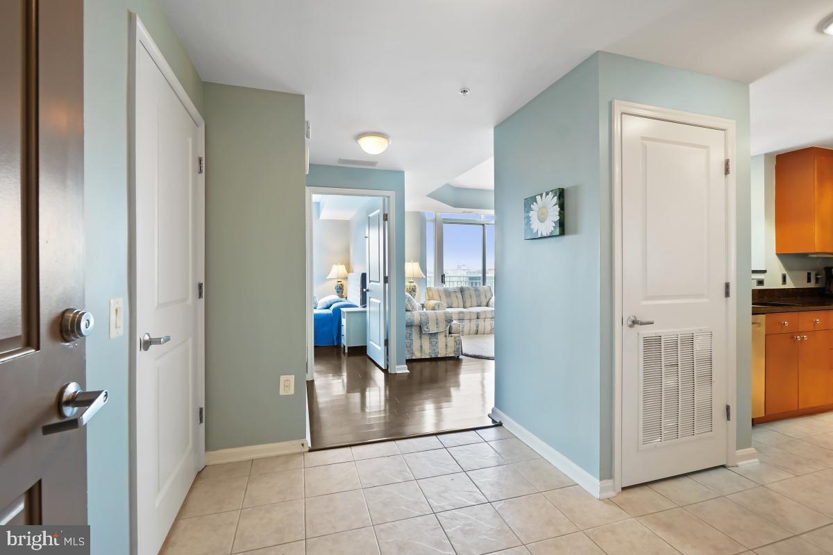 930 Wayne Avenue, Unit 1407 Silver Spring, MD 20910 - Photo 3 of 31 a view of a hallway with living room and dining room view