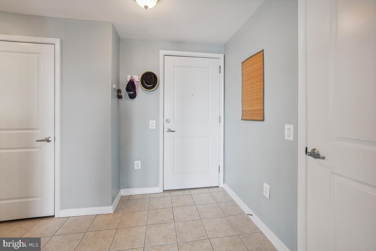 930 Wayne Avenue, Unit 1407 Silver Spring, MD 20910 - Photo 4 of 31 a view of an empty room with closet and a window