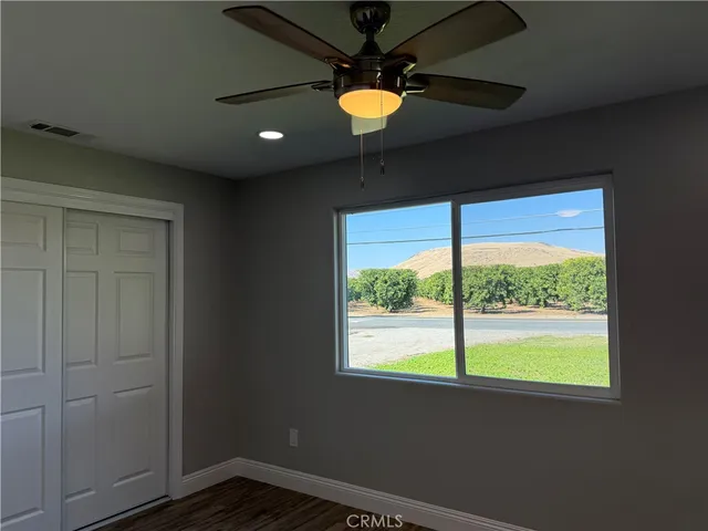 a view of an empty room with windows