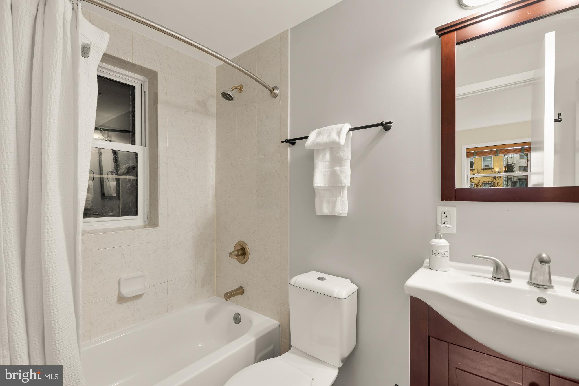 3534 10th Street Northwest, Unit 200 Washington, DC 20010 - Photo 20 of 34 a bathroom with a sink toilet and shower