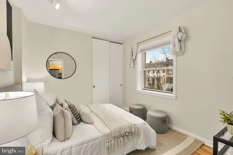 a bedroom with bed and a window