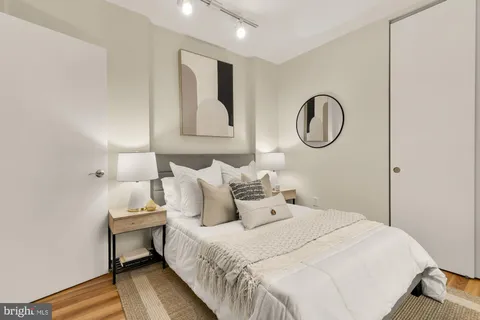 a bedroom with bed and a window