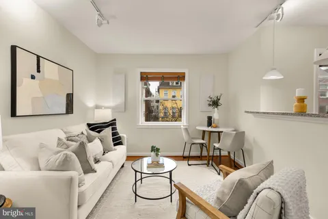 a living room with furniture and a table