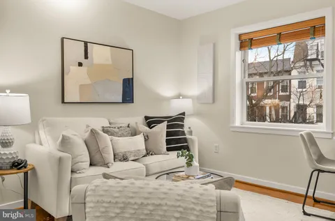 a bedroom with furniture and a window