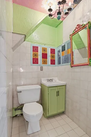 a bathroom with a toilet and a sink