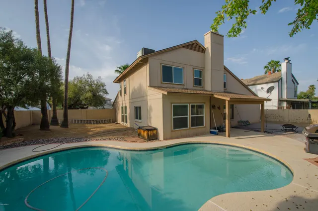 swimming pool view with a outdoor seating
