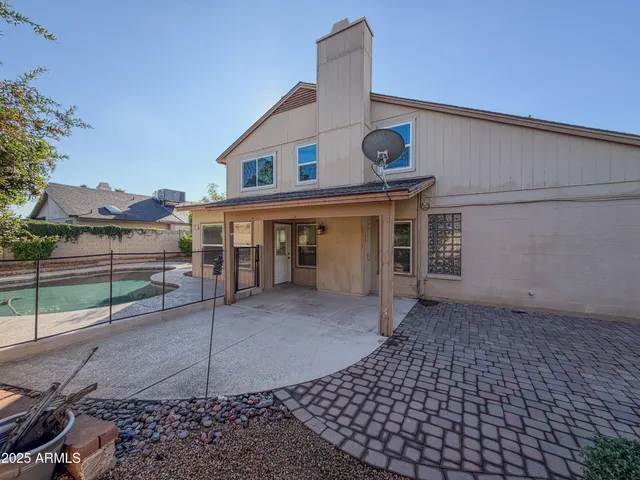a view of a house with a street