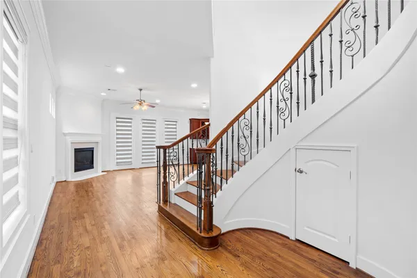 a view of entryway with wooden floor and stairs