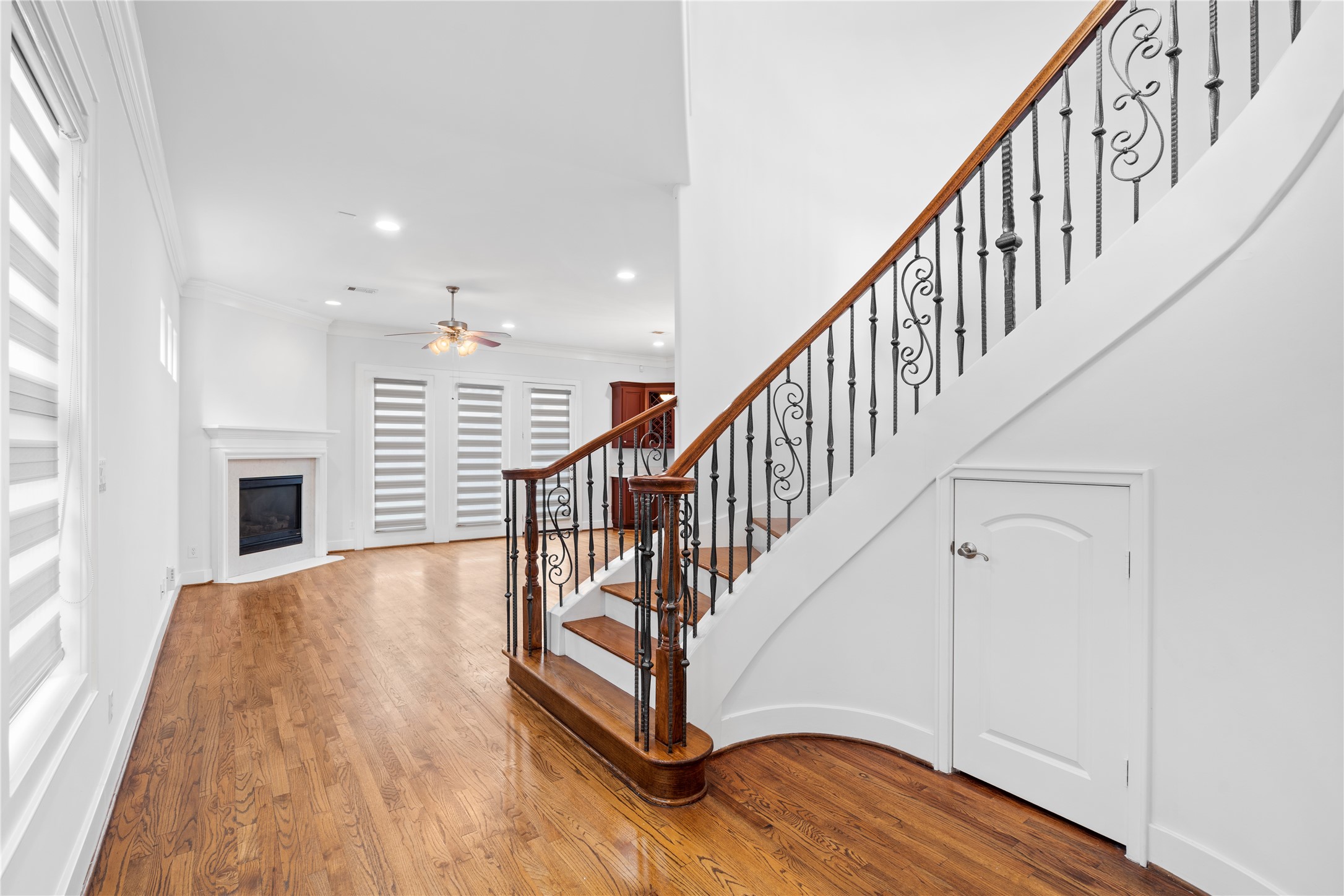 3006 McCulloch Circle Houston, TX 77056 - Photo 11 of 29 a view of entryway with wooden floor and stairs