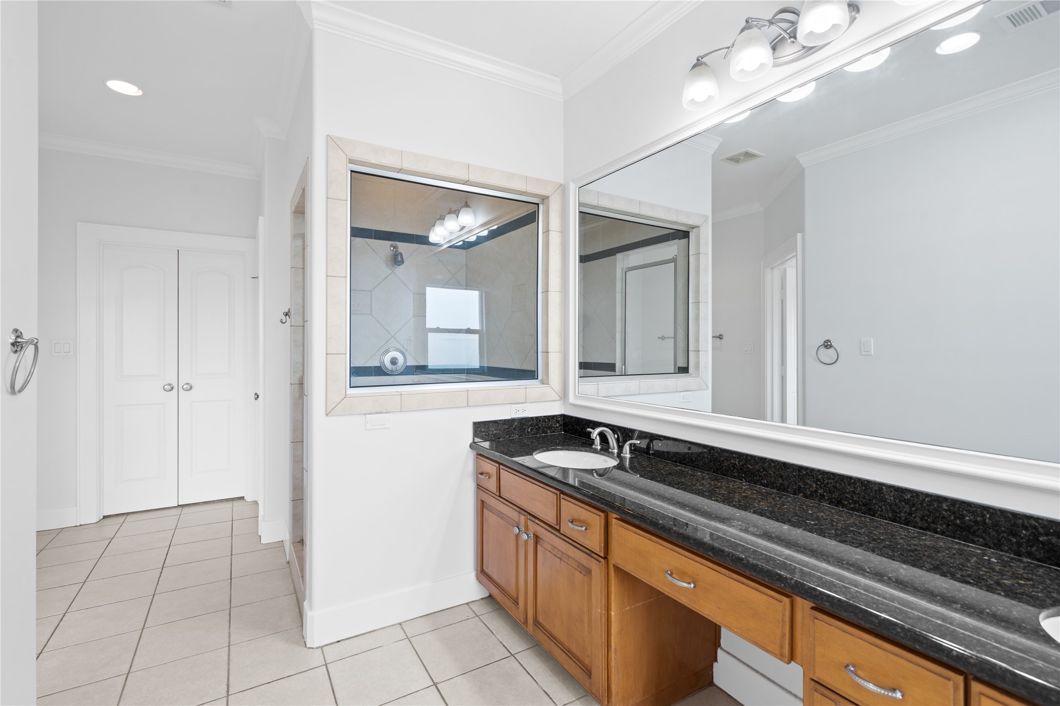 3006 McCulloch Circle Houston, TX 77056 - Photo 16 of 29 a bathroom with a sink a vanity and a mirror