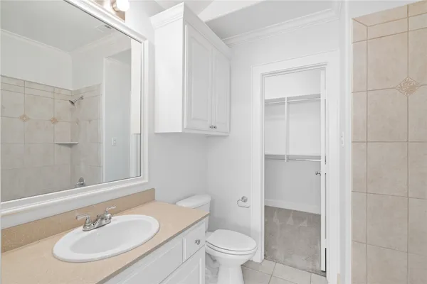 a bathroom with a sink toilet a mirror and vanity