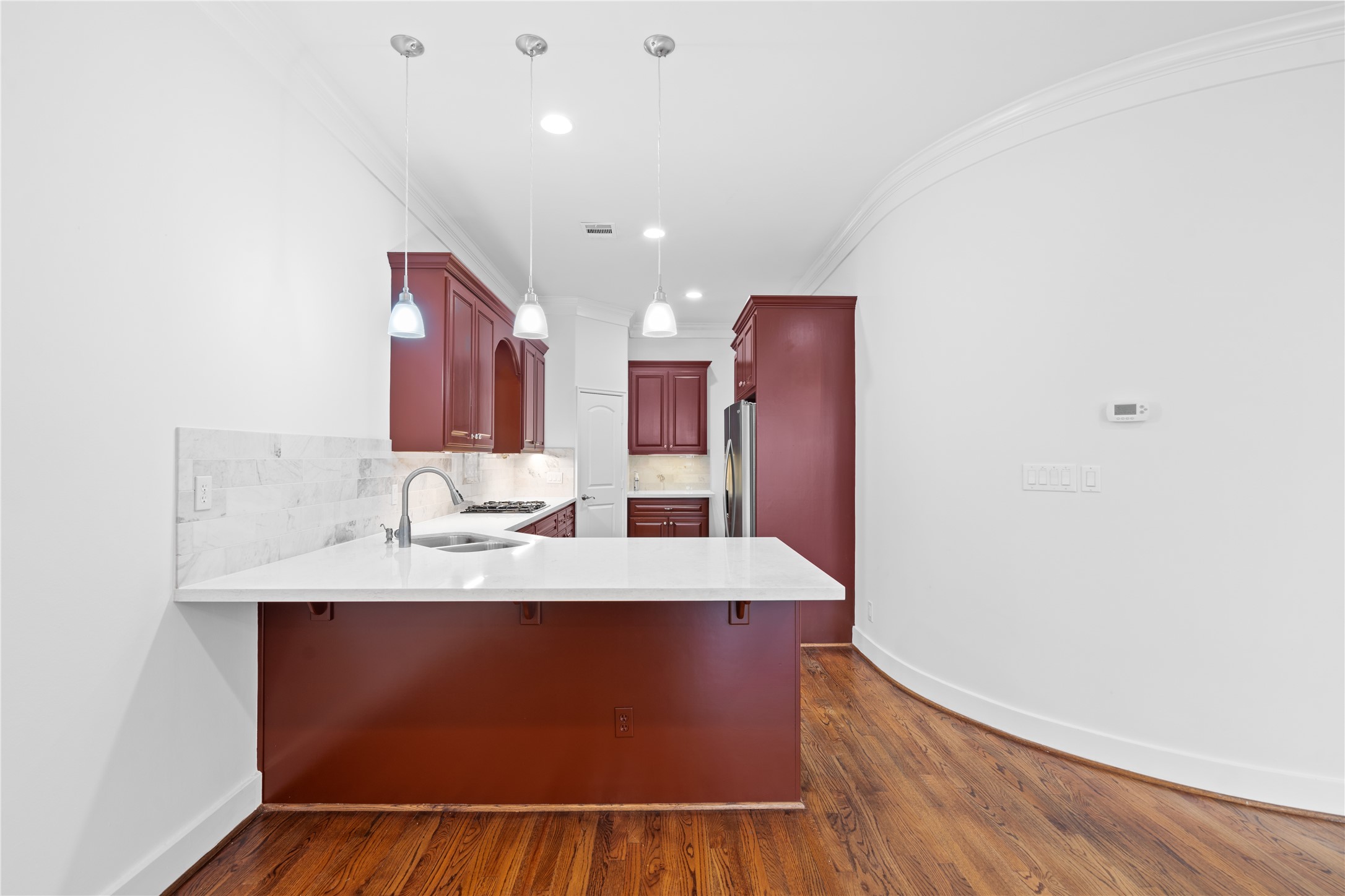 3006 McCulloch Circle Houston, TX 77056 - Photo 7 of 29 a view of a kitchen counter space and wooden floor