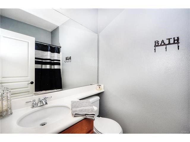 55 Ellsworth Street, Unit 27 Ladera Ranch, CA 92694 - Photo 25 of 34 a bathroom with a sink and a mirror