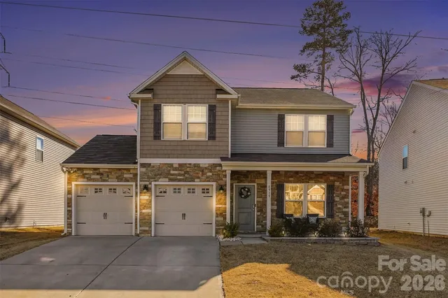 a front view of a house with yard