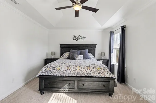 a bedroom with a bed and window