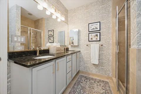a hallway with sink and mirror