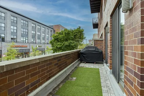 a view of balcony with a potted plant