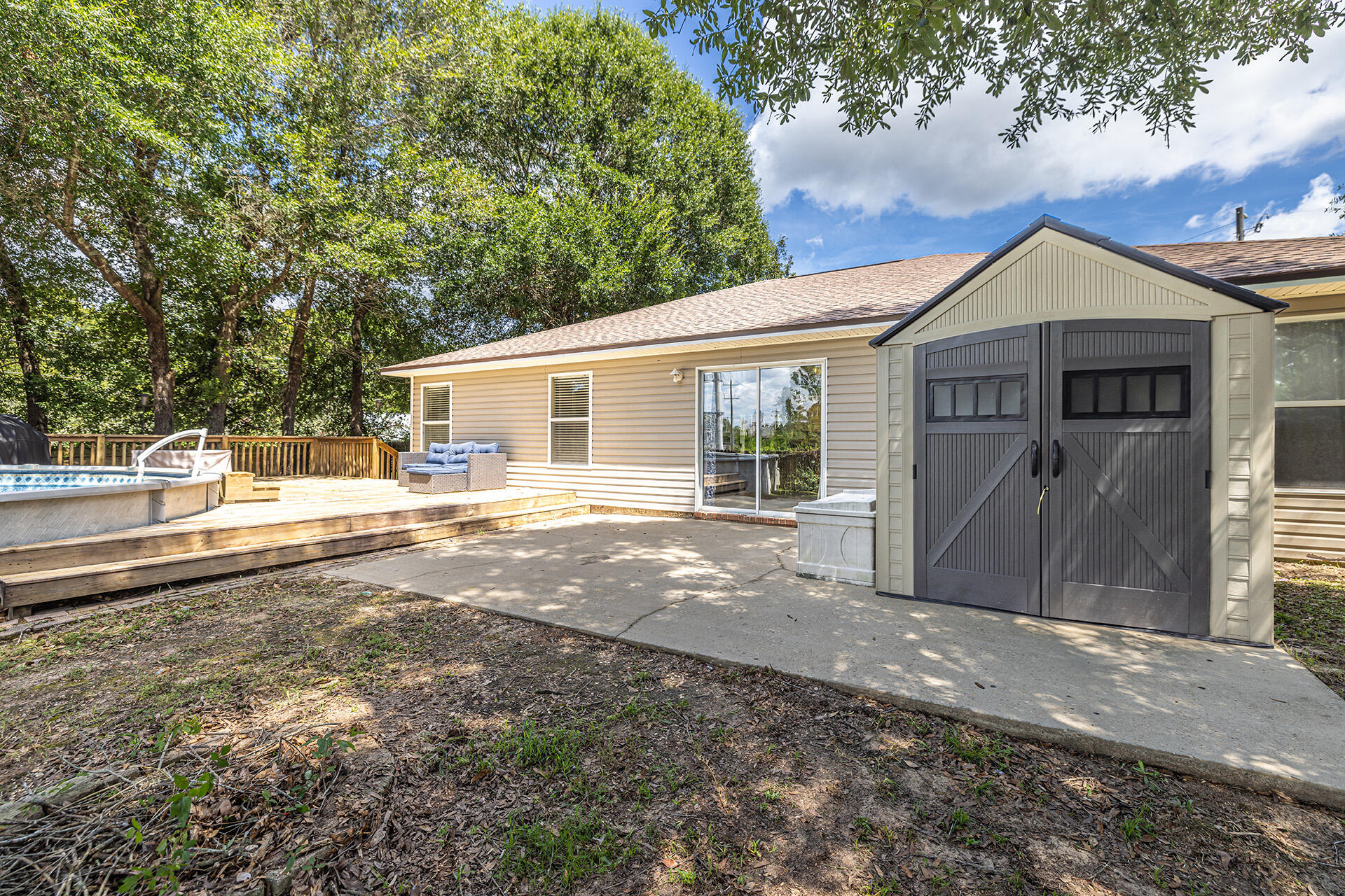 201 Lustan Drive Crestview, FL 32536 - Photo 13 of 34 a front view of a house with a yard and garage