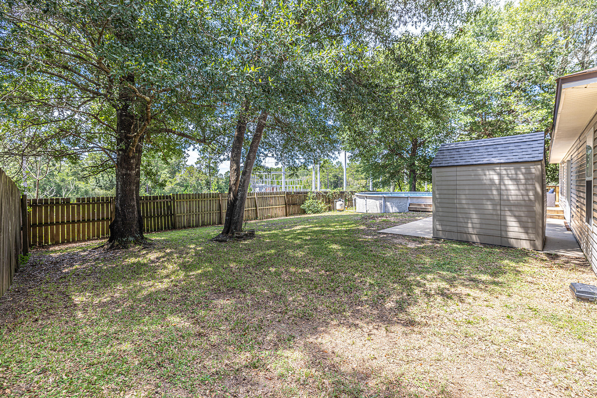 201 Lustan Drive Crestview, FL 32536 - Photo 14 of 34 a view of a yard with a tree