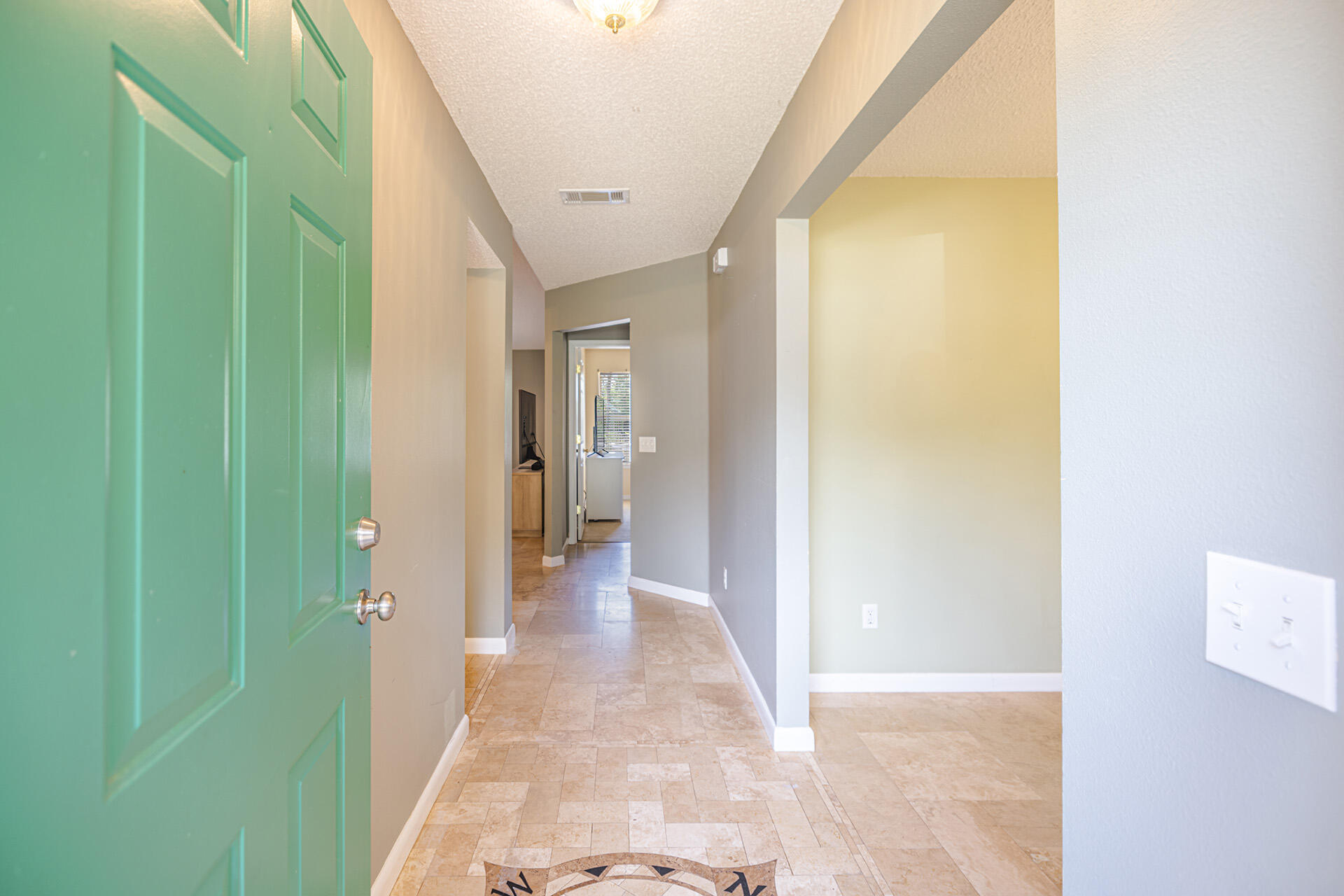 201 Lustan Drive Crestview, FL 32536 - Photo 15 of 34 a view of a hallway with wooden shelves
